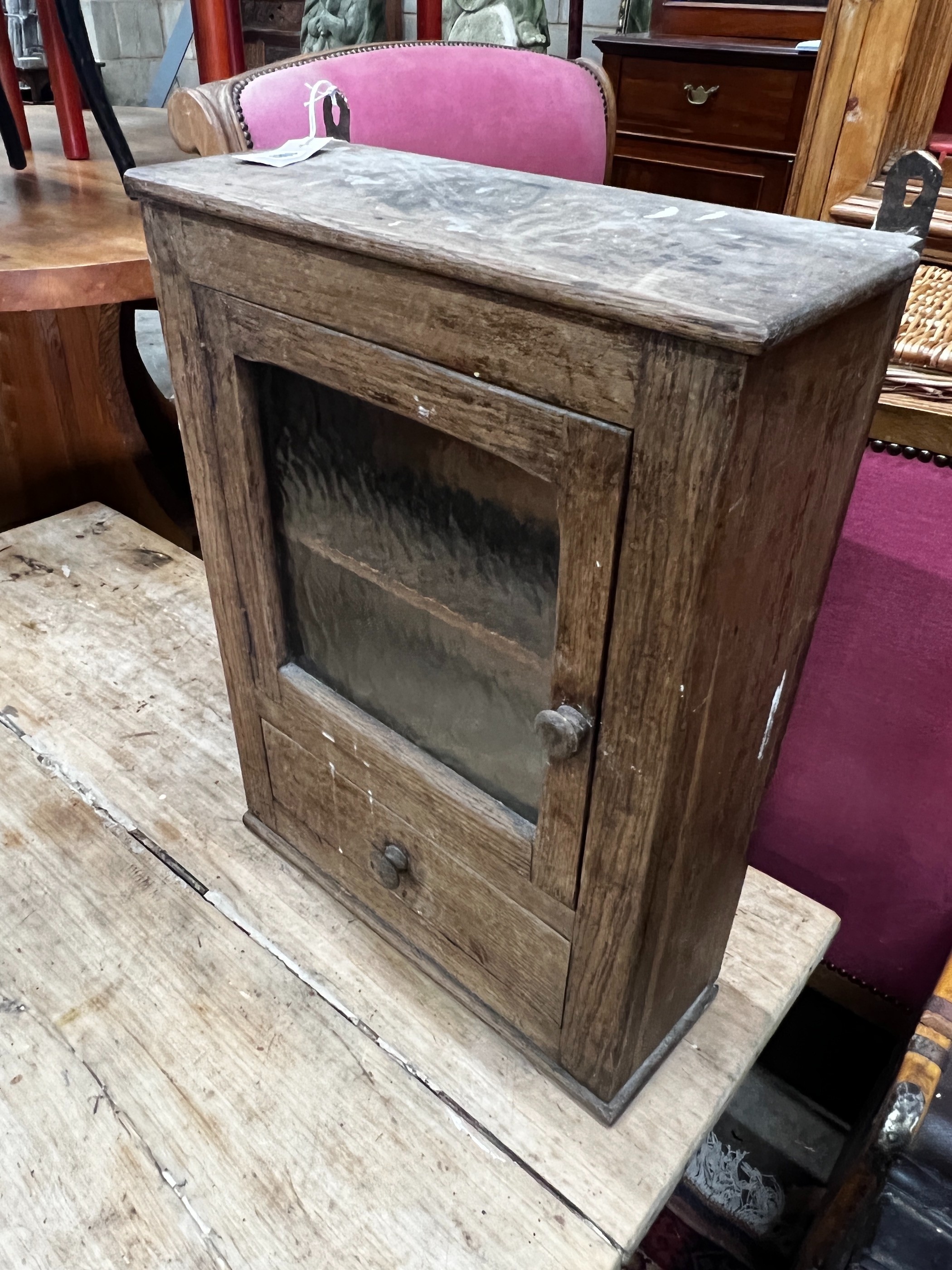 A small provincial glazed oak wall cabinet, width 43cm, depth 16cm, height 56cm